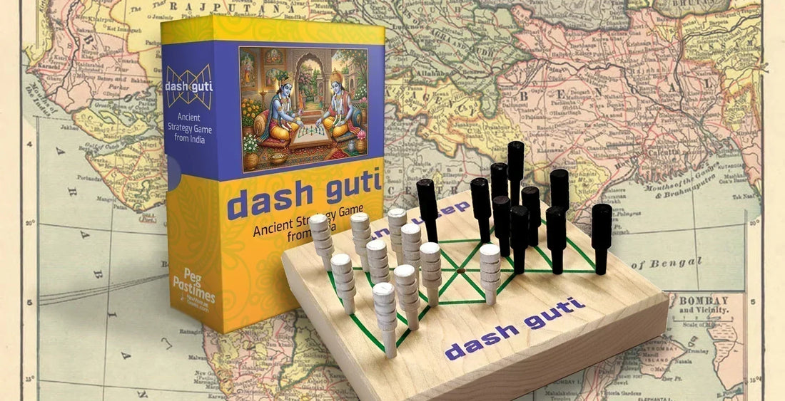 Dash Guti strategy game box and wood board with black and white pegs already in play