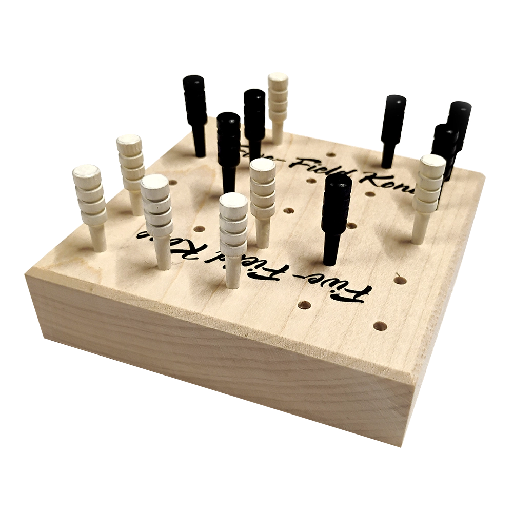 A wooden peg game board with black and white pegs arranged on a light natural wood base, photographed on a plain white background.