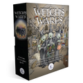 Witch's Wares card game box shown at a three-quarter angle on a white background. The box features a dark black spine and a detailed, sepia-toned front illustration of three witches in a shop.