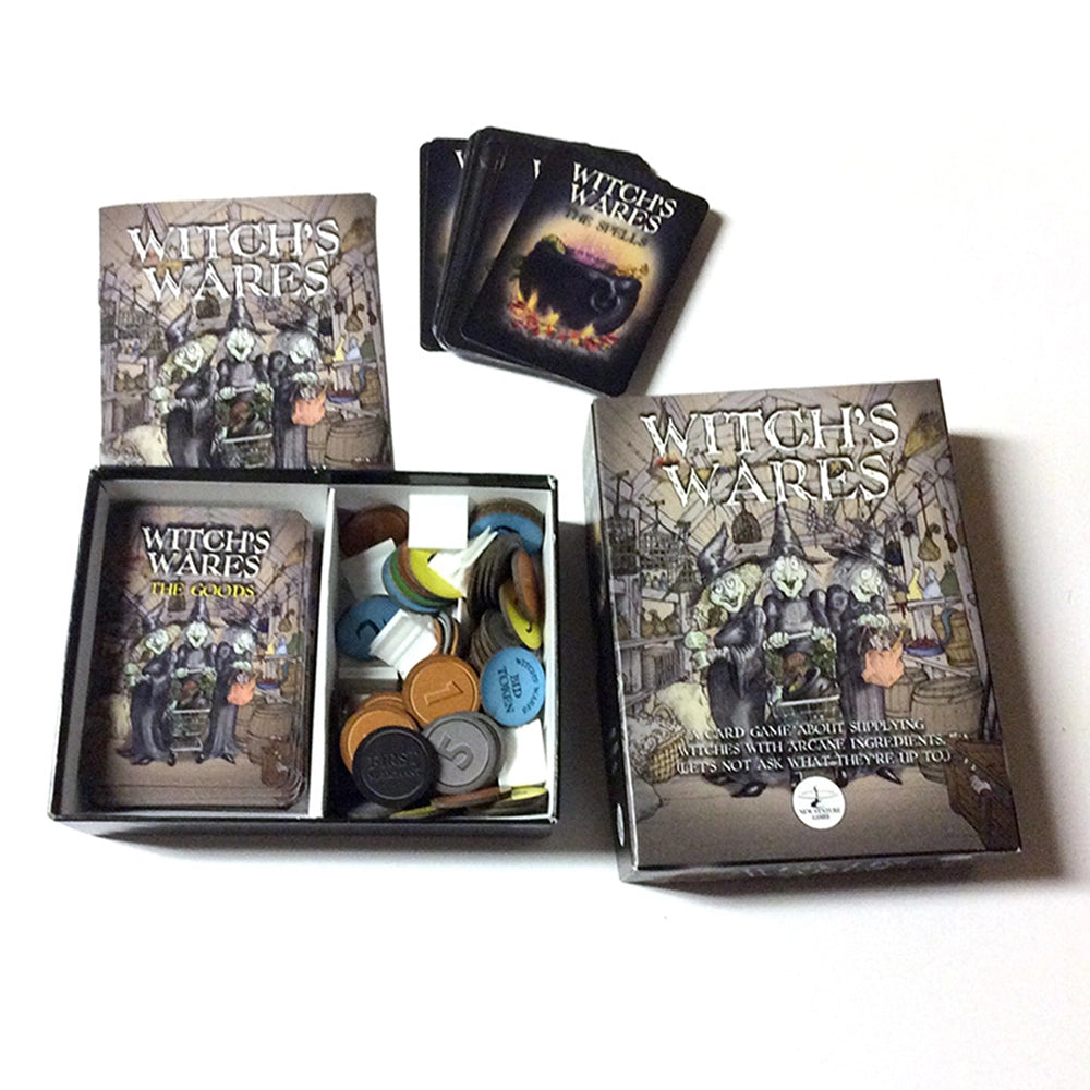 Witch's Wares board game components arranged on a white background, including the main box, a smaller box, a deck of cards, and an open tray filled with colored tokens.
