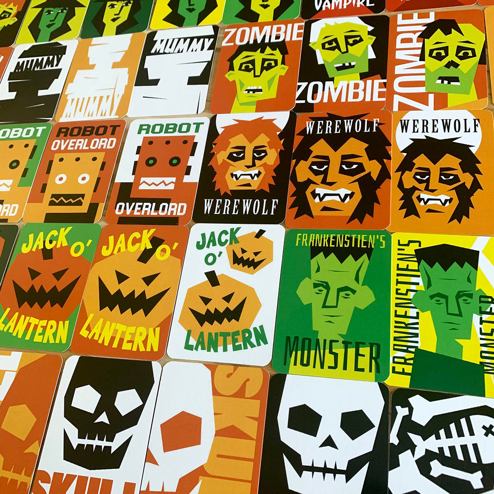 A collage of colorful Halloween-themed square cards featuring jack-o'-lanterns, werewolves, zombies, Frankenstein's monster, skulls, and text like 'Robot Overlord' and 'Zombie'.
